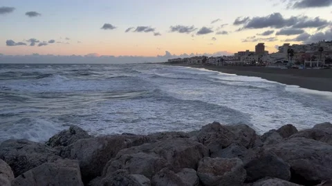 Torremolinos beach during the storm at sunset Stock Footage 239537277