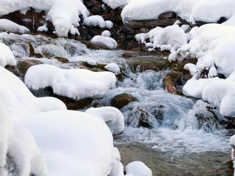 Torrent in winter Stock Photos