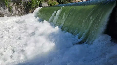 Torrential flow over Lower Falls in downtown Spokane after heavy rains 4K. Stock Footage 199855062