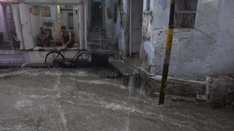 Torrential monsoon rain flooding streets Udaipur, India Stock Footage