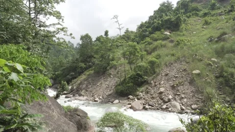 A torrential river flows through the mountainous region. Stock Footage 250117252
