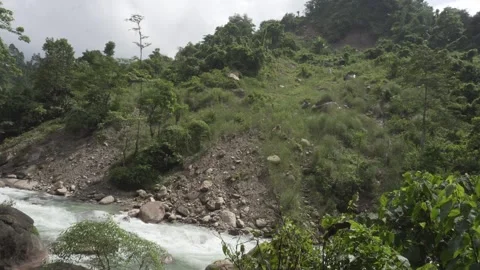 A torrential river flows through the mountainous region. Stock Footage 250118703