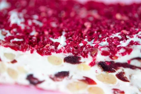 Torrone or nougat bar with nuts and red dried berries Stock Photos