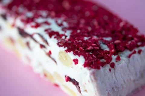 Torrone or nougat bar with nuts and red dried berries Stock Photos