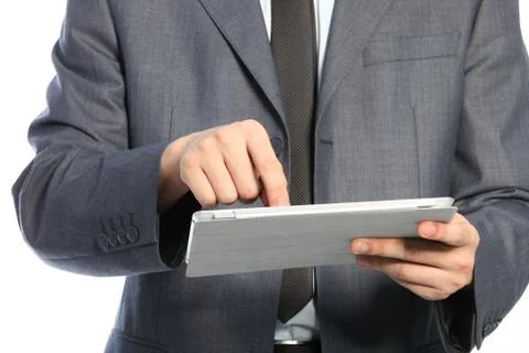 Torso of a businessman using a pc tablet Stock Photos
