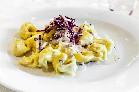 Tortelli with Salmon and Red radish. Gourmet restaurant. Italian genuine food Stock Photos