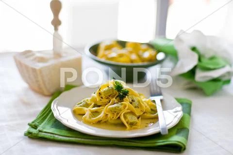 Tortellini with butter and sage Stock Photos