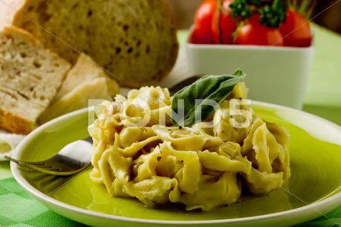 Tortellini with butter and sage Stock Photos