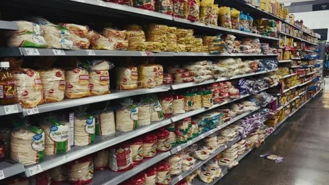 Tortilla bread packages stacked in grocery store aisle 스톡 동영상 316284482