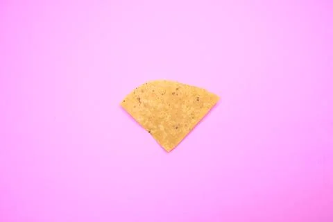 Tortilla Chip on Solid Background Fotos de archivo