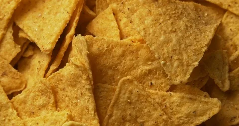 Tortilla Chips background on rotating table Stockbeeldmateriaal 122078998