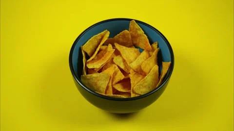 Tortilla Chips Disappear One For One From Plate. Stop Motion Stock Footage 243308553