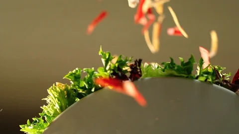 Tortilla chips falling on salad plate GT9444 Video stock 129765898