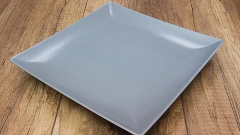 Tortilla chips fill a rectangular plate - stop motion animation Stock Footage 126224032