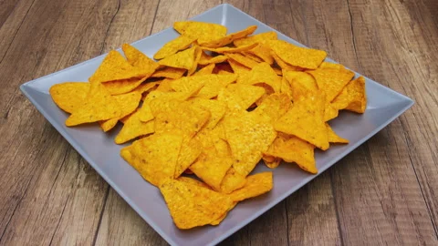 Tortilla chips on rotating plate - stop motion animation Видео 151404395