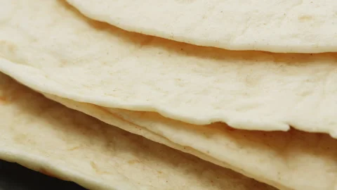 Tortilla flat bread macro close up presentation slowly rotating stock footage Stock Footage 344855050