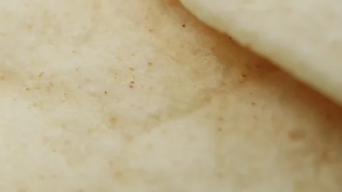 Tortilla flat bread macro close up presentation slowly rotating stock footage Stock Footage 344855759
