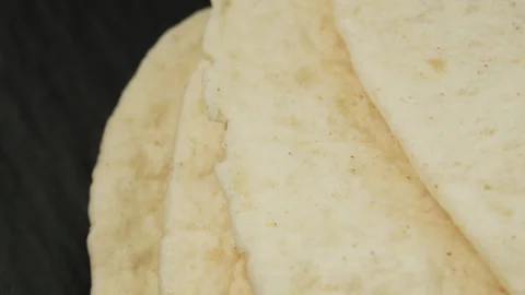 Tortilla flat bread macro close up presentation slowly rotating stock footage Stock Footage 344856496