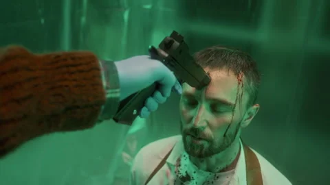 Tortured Man Talking to Killer with Gun Pressed to His Forehead Stock Footage 301508580
