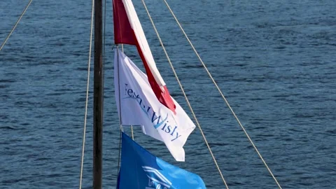 Torun, Poland, 13 August 2026: Flags waving in the wind during Vistula Festival Stock Footage 342192905
