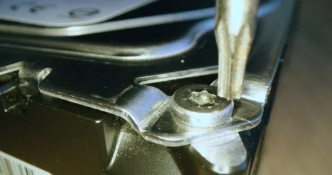 Torx screw being undone fixing computer Video stock 134997200