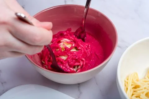 Toss pasta or spaghetti with beetroot-garlic sauce to give it color. Stock Photos