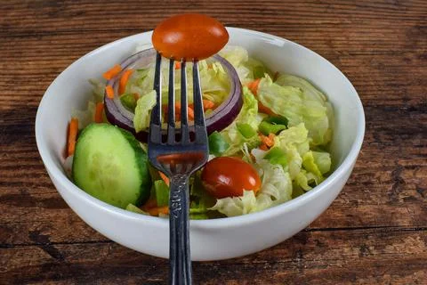 Toss salad with  a fork Stock Photos
