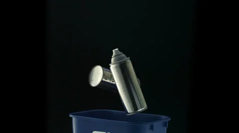 Tossing empty spray bottle into trash can, Slow Motion Stock Footage 31819426