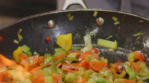Tossing Mixed Vegetable Pieces in Frying Pan during Flambe Cooking 스톡 동영상 330062253