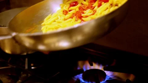 Tossing pasta in a restaurant Stock Footage 306408536