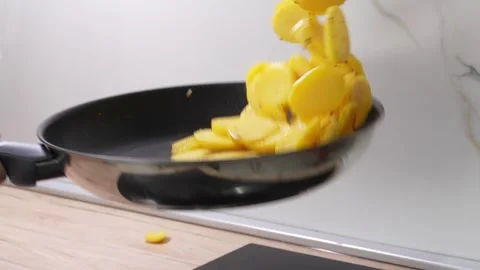 Tossing Potatoes in a Frying Pan. Stock Footage 255746149
