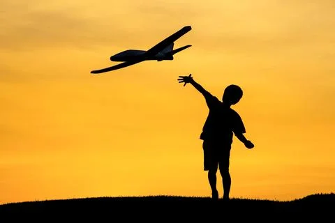 Tossing a toy plane. Stock Photos