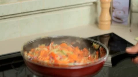 Tossing vegetables in a pan - slow motion Stock Footage 12719872