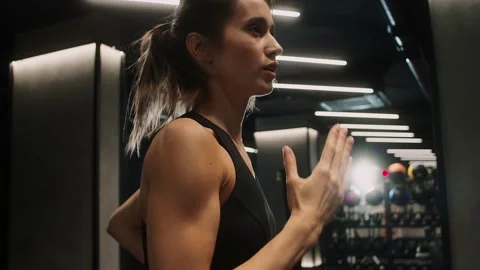 Total body kettlebell workout. Young nice-looking fit female Caucasian athlete Stock Footage 189008772