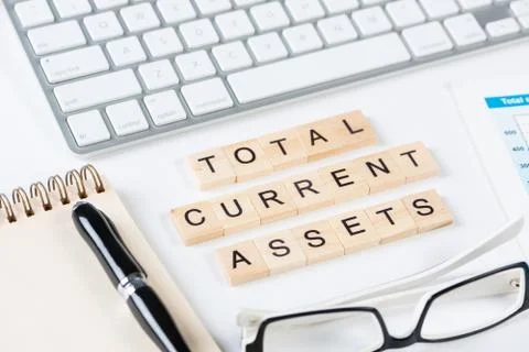 Total current assets concept with letters Stock Photos