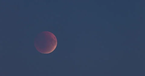 Total Lunar Eclipse Moving Across Dark Blue Sky, Timelapse Stock Footage 340908860