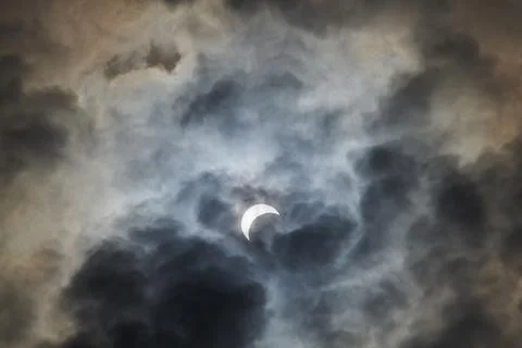 Total Solar Eclipse Against a Cloudy Sky Stock Photos