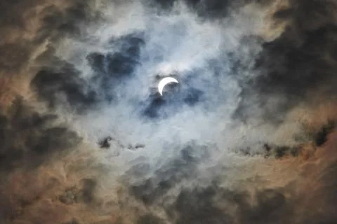 Total Solar Eclipse Against a Cloudy Sky Stock Photos