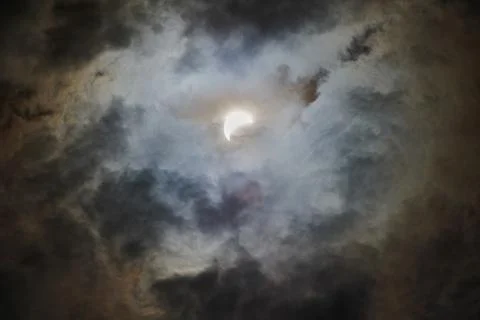Total Solar Eclipse Against a Cloudy Sky Stock Photos