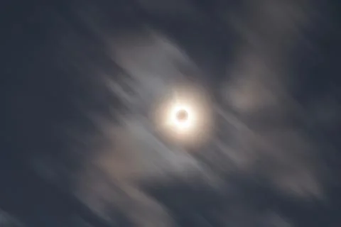 Total Solar Eclipse Against a Cloudy Sky Stock Photos