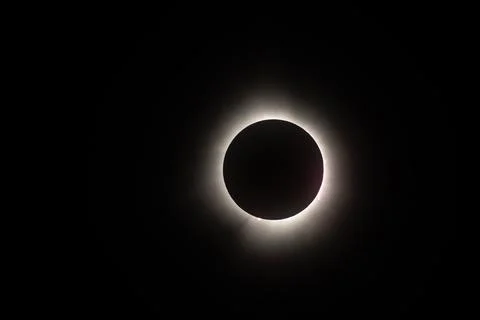 Total solar eclipse with a bright light eclipse in a dark space Stock Photos