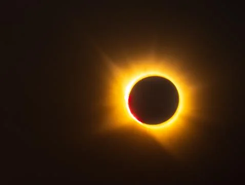Total solar eclipse with corona and red prominence Stock Photos