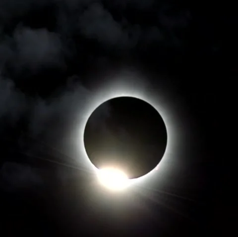 Total solar eclipse covered by light clouds Stock Footage 271476346