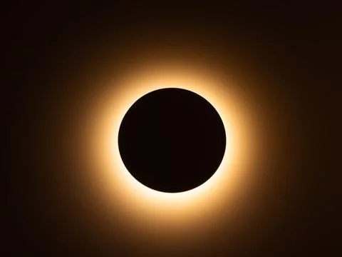Total solar eclipse with glowing corona Stock Photos