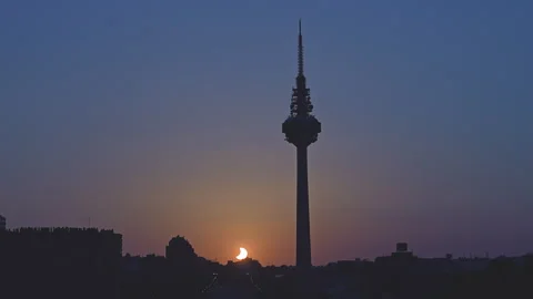 Total solar eclipse setting over Madrid skyline Stock Footage 342079860