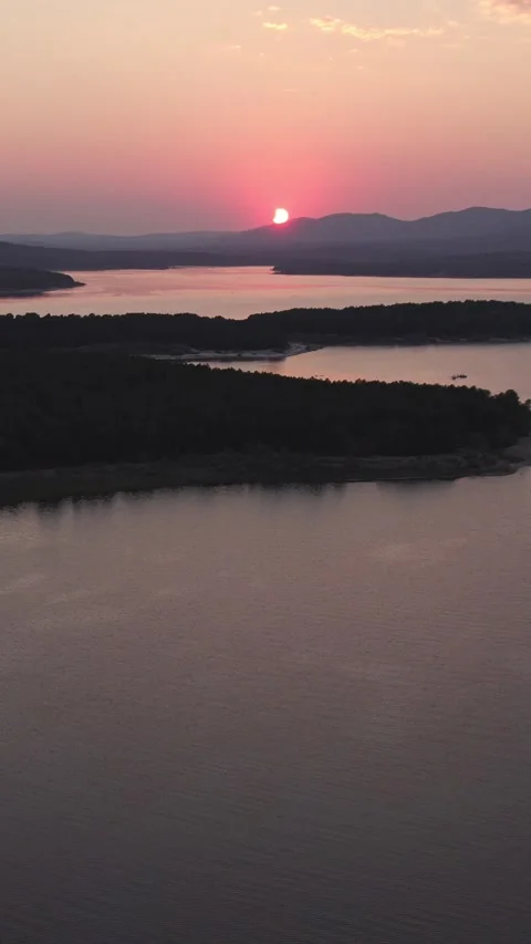 Total solar eclipse setting over Cuerda del Pozo Reservoir in Spain 動画素材 342554775