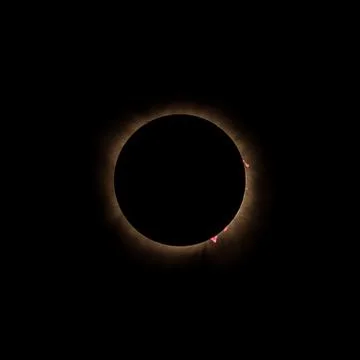 Total solar eclipse showing sun flares in a ring of fire Stock Photos