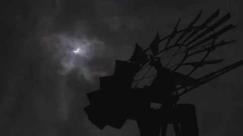 Total solar eclipse with windmill in foreground Video stock 290892883