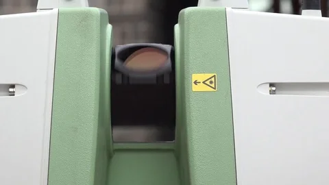 The total station laser theodolite is rotating. Total station is working. 4K Stock Footage 77006333