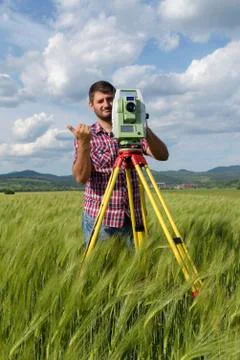 Total station Wheat field Engineer Surveyor Stock Photos